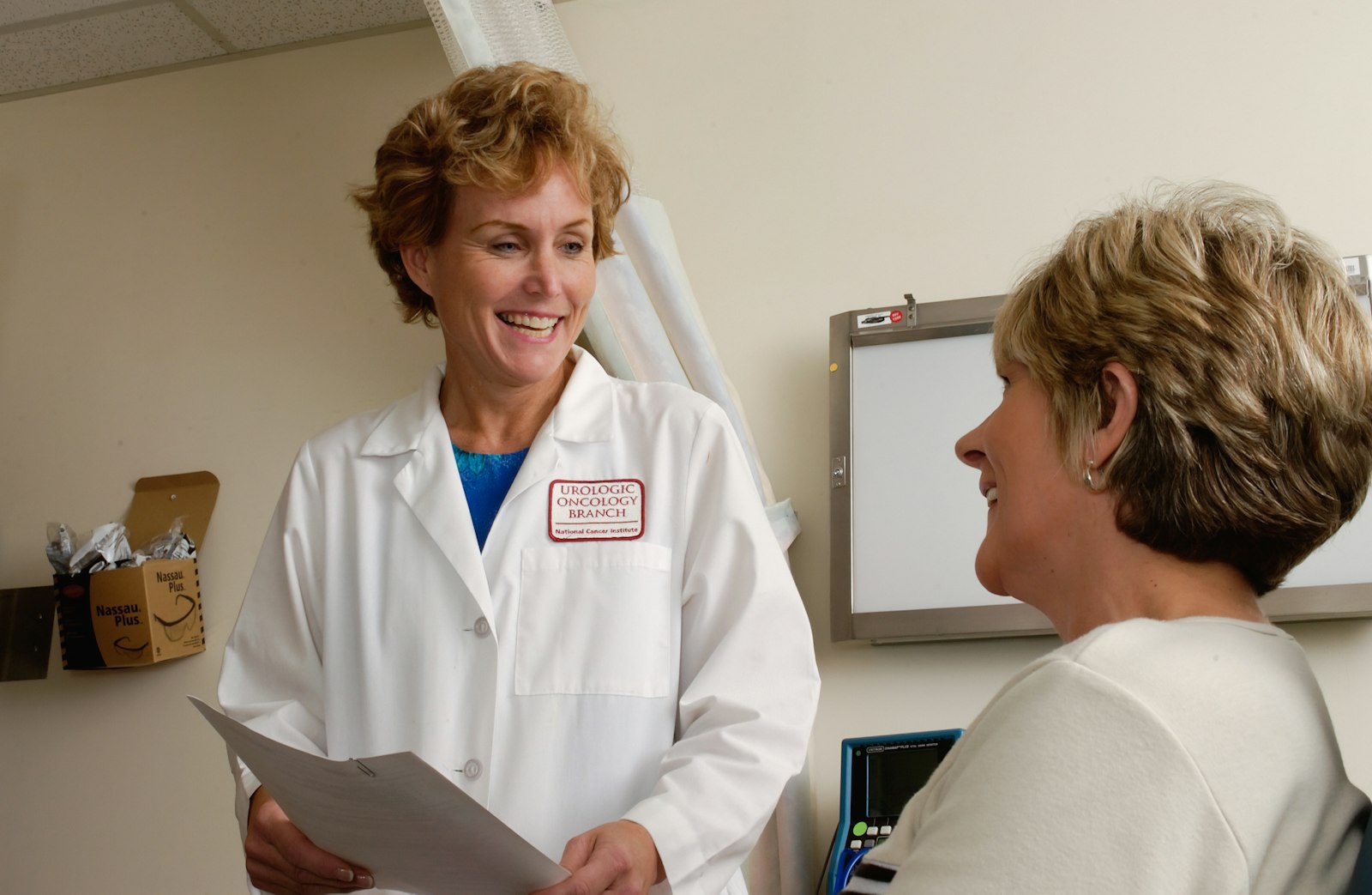 Front-desk clinician handling a scheduling call at a modern practice